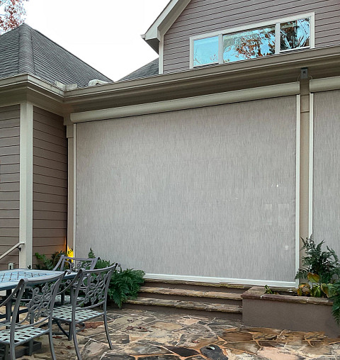 Motorized screen components on patio