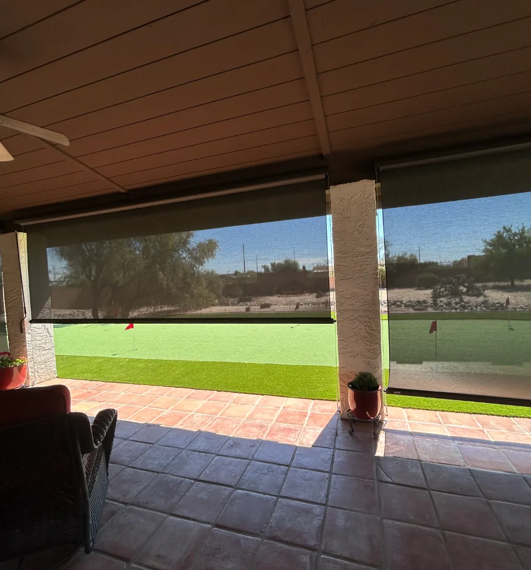 Outdoor retractable screens with exposed hardware and frames in a dry climate setting