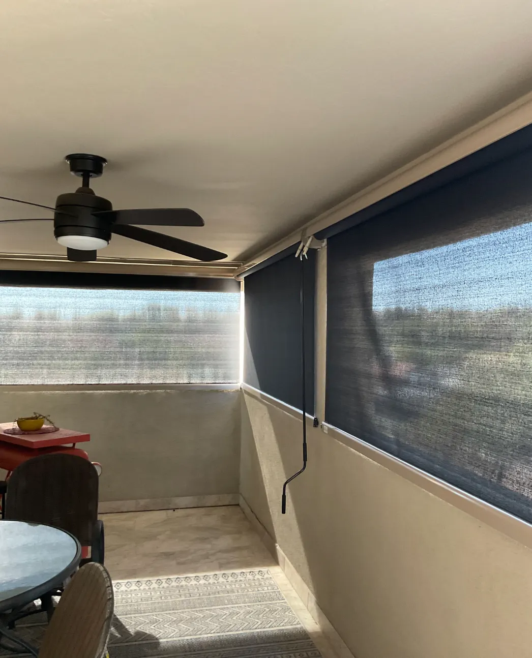Motorized and fixed screens installed on a covered patio