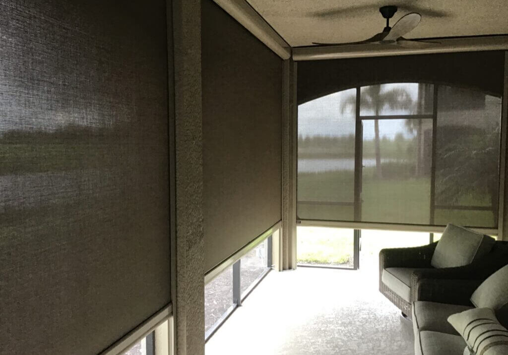 Retractable screens installed on a covered patio for shade and privacy